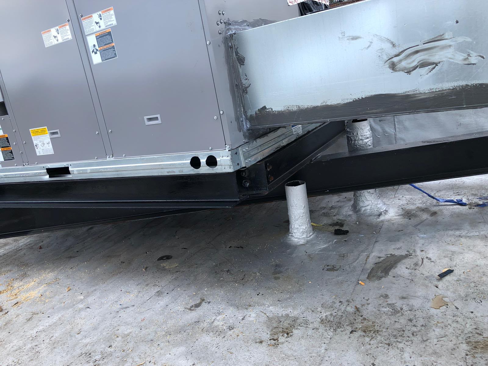 Rooftop unit curb, steel supports, and insulated refrigerant lines