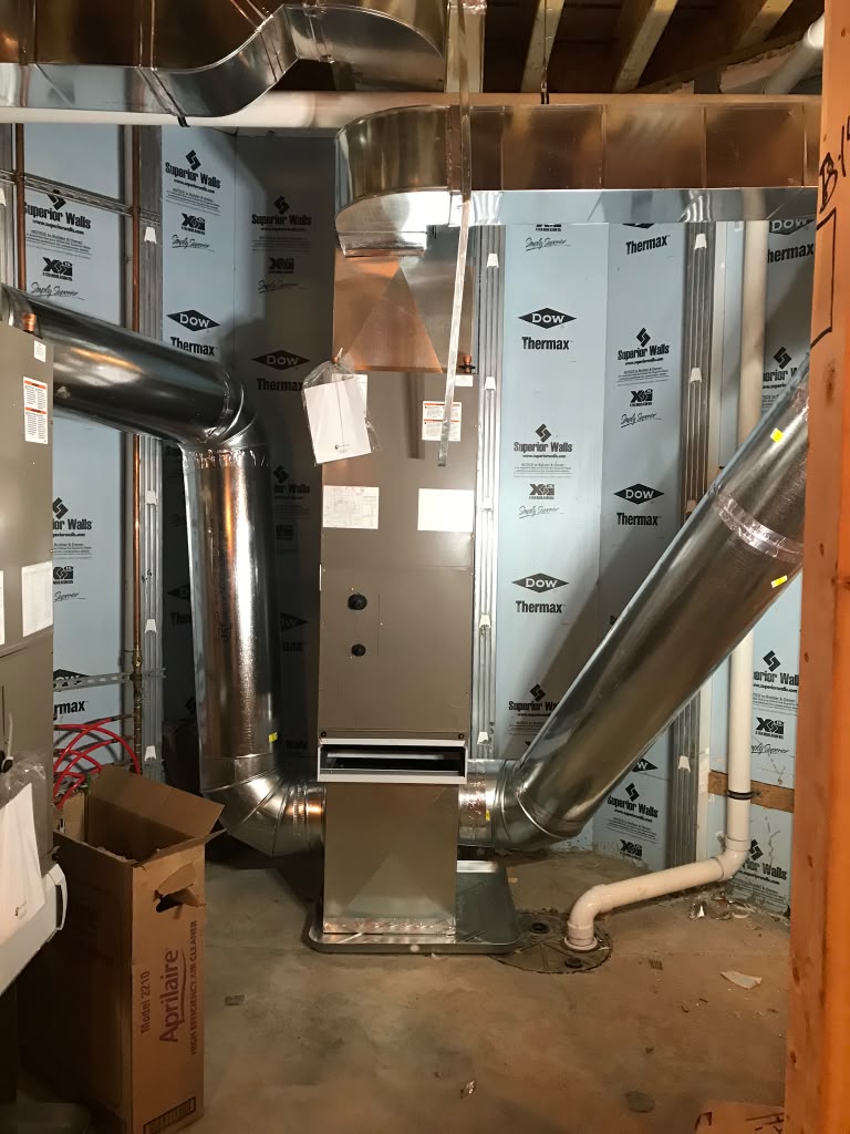 High-efficiency furnace and air handler with custom sheet metal trunk lines