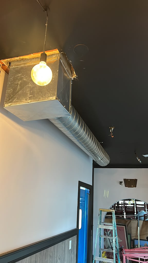 Interior spiral duct and plenum installation in a commercial space